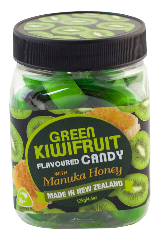 Jar of green kiwifruit-flavored candy with manuka honey, made in New Zealand. Candies are green and look like kiwifruit slices. 