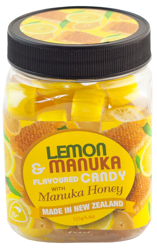 Jar of lemon and manuka honey candy with a black lid