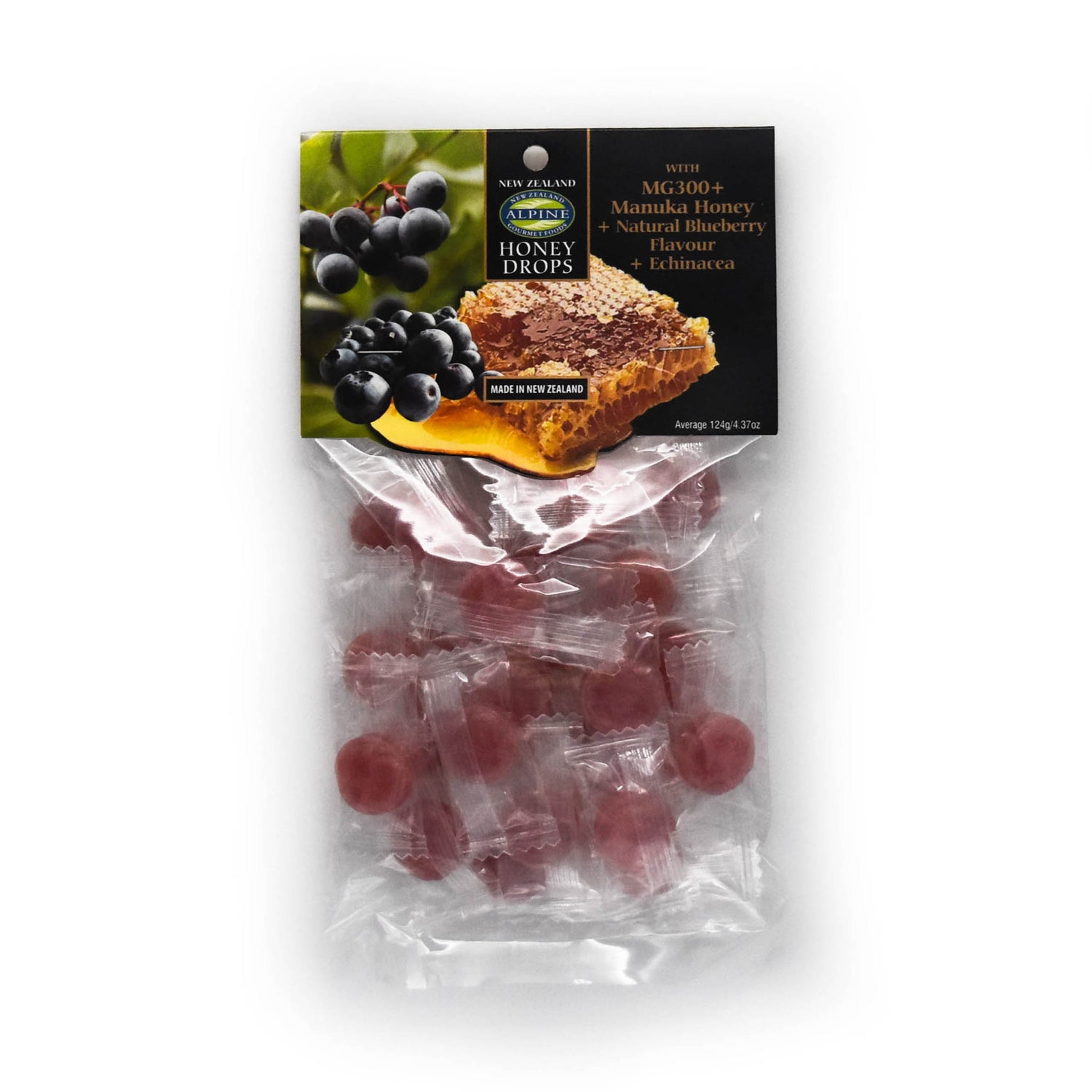 Image of a white backdrop with a packet of Blueberry Manuka Honey drops. The packaging is clear and you can see the purple-blue drops. The top of the packaging is a cardboard header that is black with a photo of blueberries and manuka honeycomb. there is also text. 