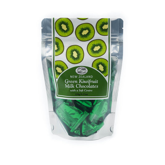 Packaging of premium milk chocolates with kiwifruit centre. The packaging is predominantly green with images of kiwifruits, and it is sealed with a clear window showing the chocolates inside.