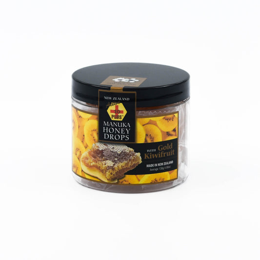 A clear jar with black lid containing individually wrapped Active 10+ Manuka Honey Drops with Gold Kiwifruit and Echinacea. The label indicates that the product is made in New Zealand and has an image of Golden Kiwifruit Slices and honeycomb 